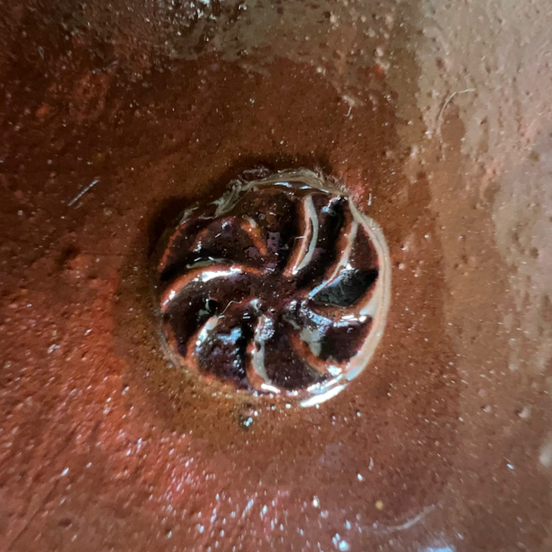 Stamped roundel on Medieval jug