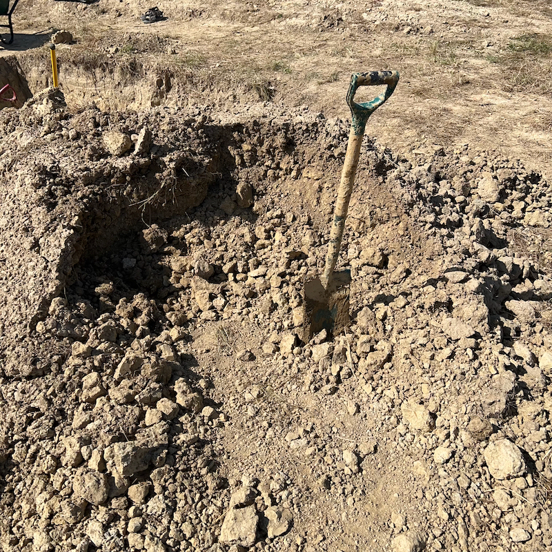Clay heap used to make cob for the earth kiln