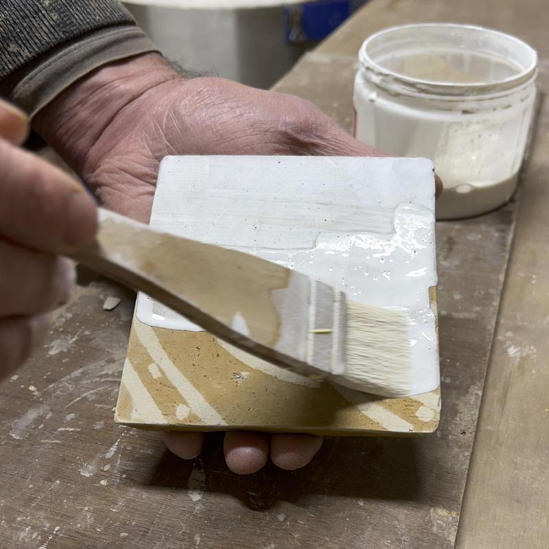 Applying a lead glaze using a brush