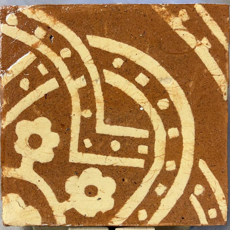 A tile showing coloured score marks in the pattern