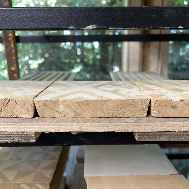 Drying tiles side by side showing bevelled edges