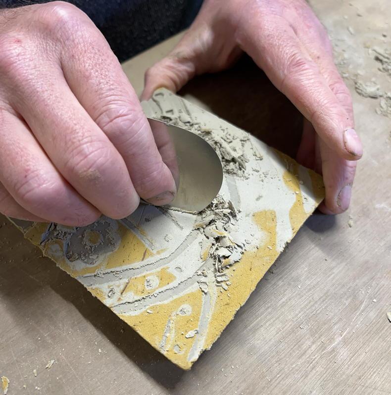 Scraping a leather hard tile