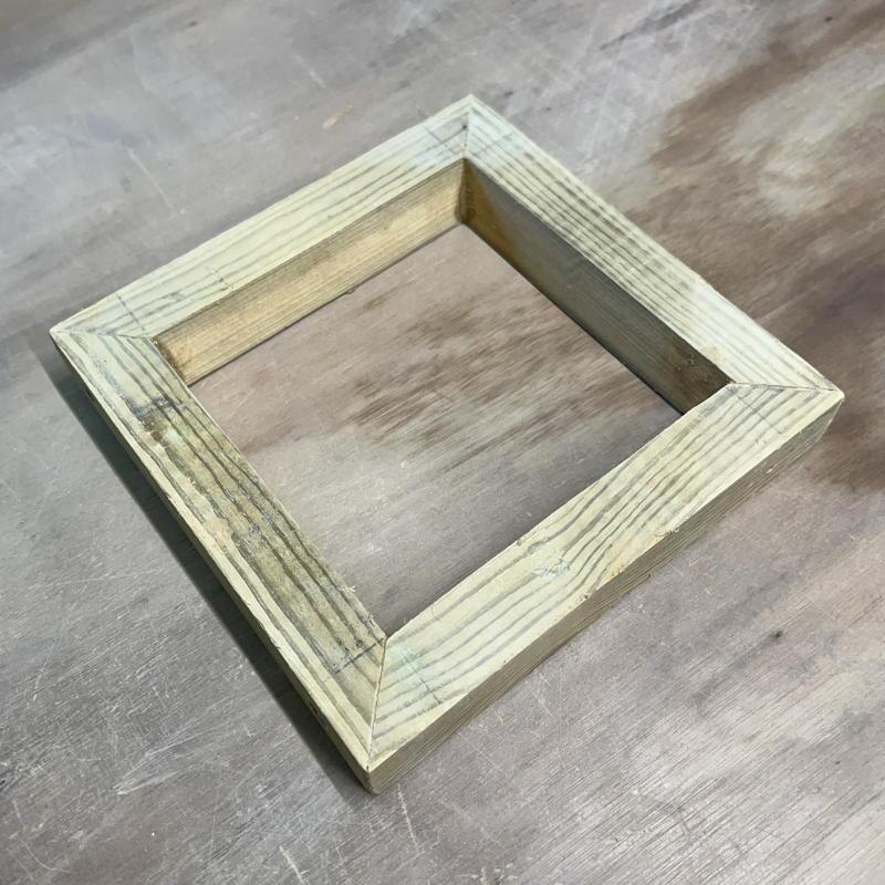 A fixed frame bevel-edged tile mould
